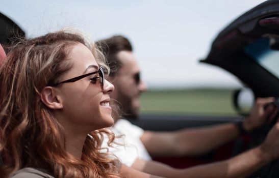 close up.couple traveling in their convertible car .family leisure concept