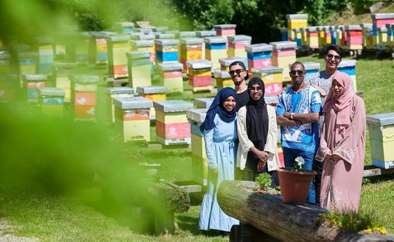 african muslim people group visiting local honey production farm