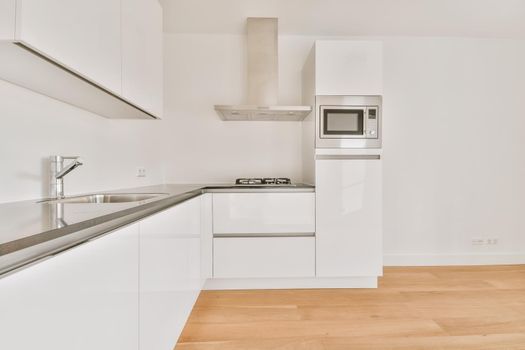 Lovely kitchen with white walls and kitchen set