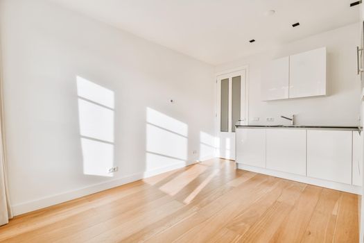 Lovely kitchen with white walls and kitchen set