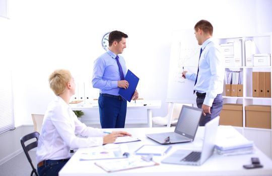 Business people sitting and discussing at business meeting .