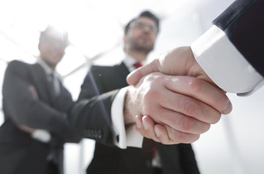 business background.business handshake.the concept of cooperation