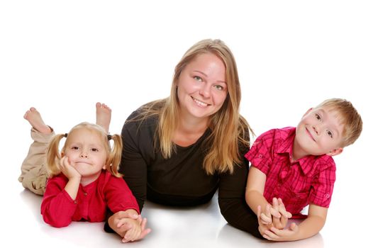 Happy young mother with two small children , a boy and a girl of preschool age.Isolated on white background