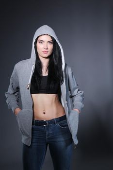 Fitness smiling woman in uniform on a blank background