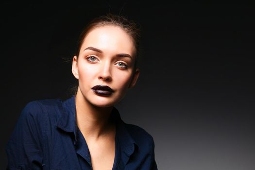 Portrait of beautiful young woman face. Isolated on black background.