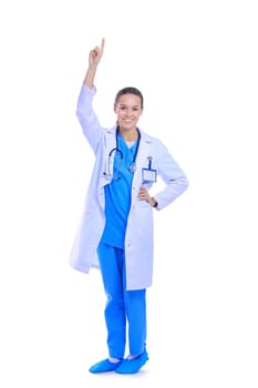 Beautiful young woman in white coat posing with hand in pocket. Woman doctor.