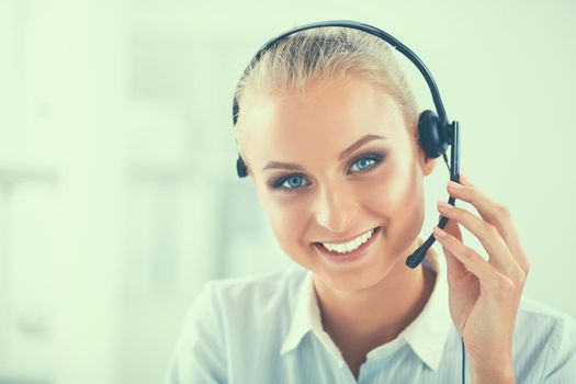 Close-up portrait of a customer service agent sitting at office.