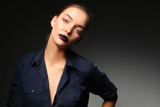 Portrait of beautiful young woman face. Isolated on black background.