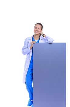 A female doctor with a blank billboard. Woman doctor.