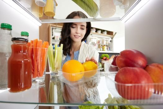 Open refrigerator with fresh fruits and vegetable. Open refrigerator.