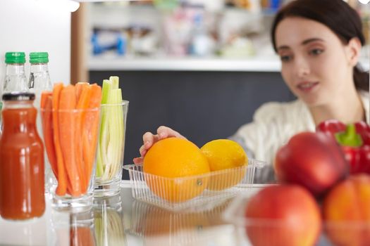 Open refrigerator with fresh fruits and vegetable. Open refrigerator.