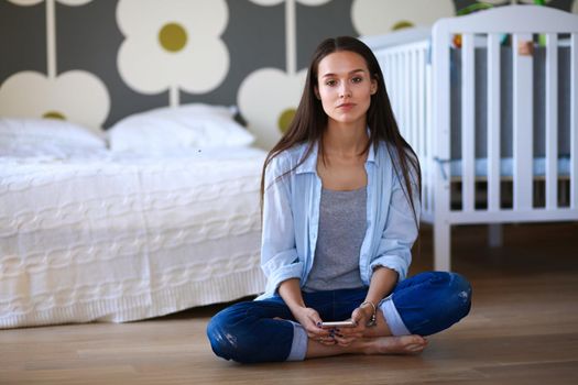 Young woman doing yoga at home in the lotus position. Young woman doing yoga