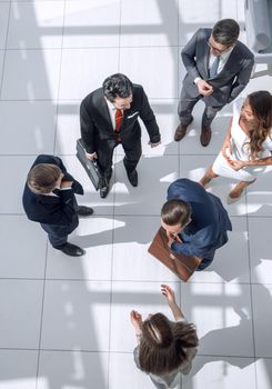 top view.a group of business people standing on a marble floor. business concept