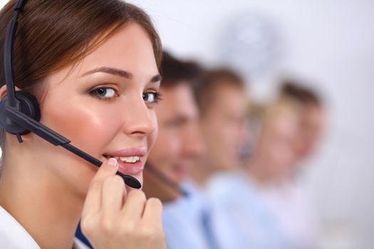 Smiling positive young businesspeople and colleagues in a call center office.