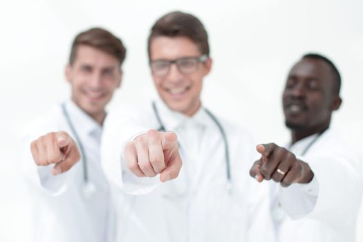 blurry image of a group of doctors pointing at you. the concept of choice