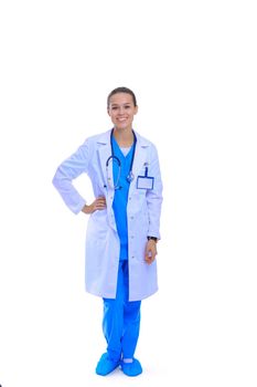 Beautiful young woman in white coat posing with hand in pocket. Woman doctor.