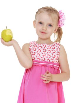 Little girl in pink dress holds in hands otkusannoe apple isolated on a white background.