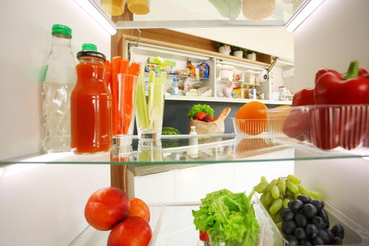 Open refrigerator with fresh fruits and vegetable. Open refrigerator.