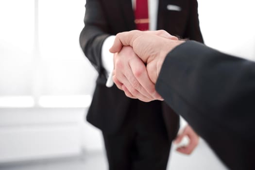 close up.handshake business partners.business concept