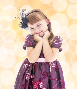 Portrait of a charming young girl in a magnificent dress.Happiness, winter holidays, new year, and childhood.