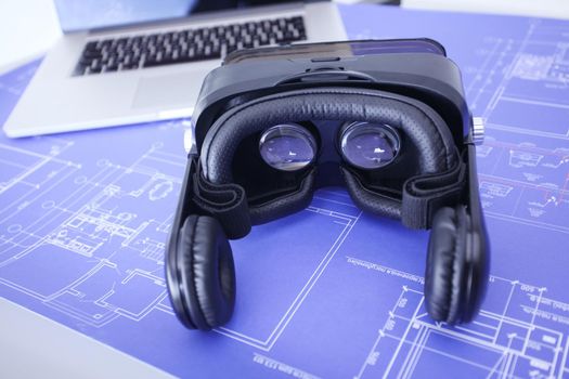 Virtual reality goggles on desk with laptop. business. 3d technology.