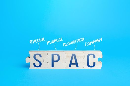 Wooden puzzle blocks with abbreviation SPAC (Special purpose acquisition company). Simplified listing of company, merger bypassing stock exchange IPO. Assessment of benefits and risks of investments