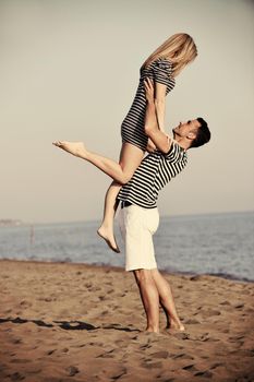 happy young couple have fun and romantic moments on beach at summer season and representing happynes and travel concept