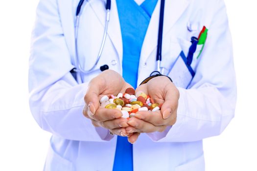 Doctor holding heap of drugs in a hand. Woman doctor