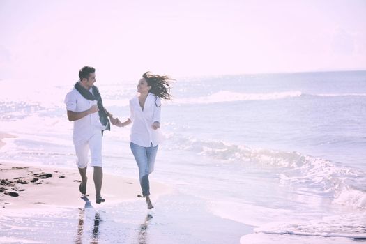 happy young couple in white clothing  have romantic recreation and   fun at beautiful beach on  vacations