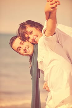 happy young couple in white clothing  have romantic recreation and   fun at beautiful beach on  vacations