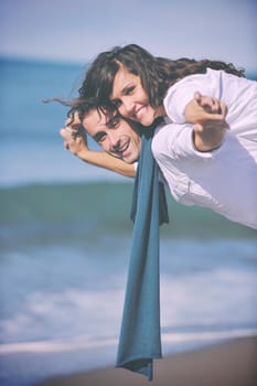 happy young couple in white clothing  have romantic recreation and   fun at beautiful beach on  vacations