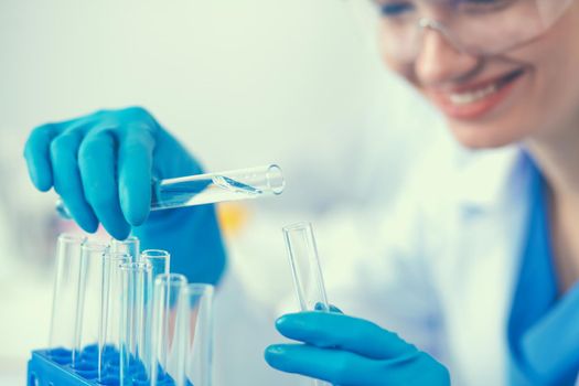 Woman researcher is surrounded by medical vials and flasks, isolated on white background.