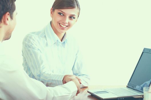 Young business team working on computer in office.