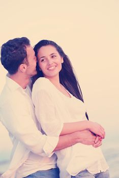 happy young romantic couple in love have fun on beautiful beach at beautiful summer day