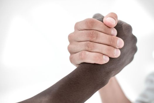 close up.friendly handshake of business partners .the concept of unity