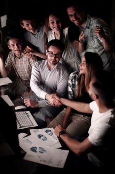 business people shaking hands over the Desk.the concept of teamwork