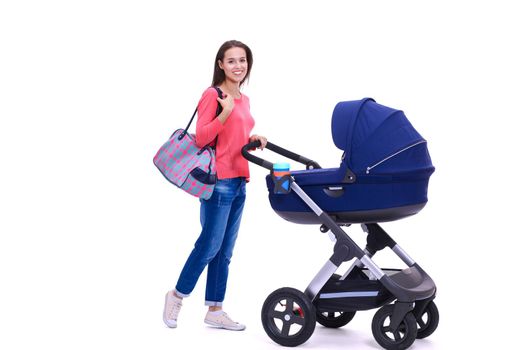 Full length portrait of a mother with a stroller, isolated on white background. Young mom.