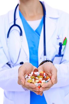 Doctor holding heap of drugs in a hand. Woman doctor