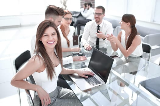 young business woman and her colleagues sitting at the office table.business concept
