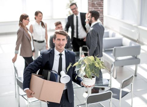 young employee standing in office on his first day.the concept of employment