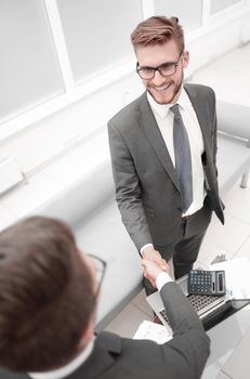 close up.business people greet each other with a handshake.business concept