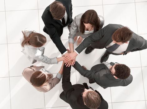 top view.a group of employees standing in a circle.the concept of teamwork