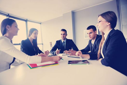 Group of happy young  business people in a meeting at office