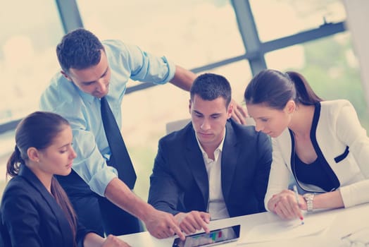 Group of happy young  business people in a meeting at office