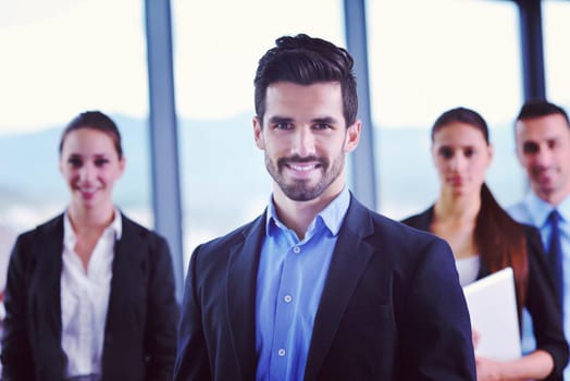 Group of happy young  business people in a meeting at office