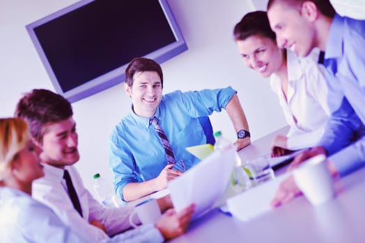 Group of happy young  business people in a meeting at office