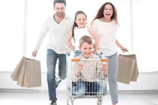 happy family with cart and kids .photo with copy space