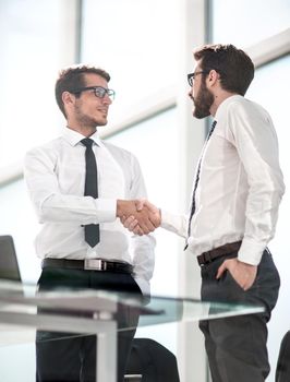 business people shaking hands with each other.the concept of cooperation