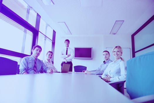 Group of happy young  business people in a meeting at office