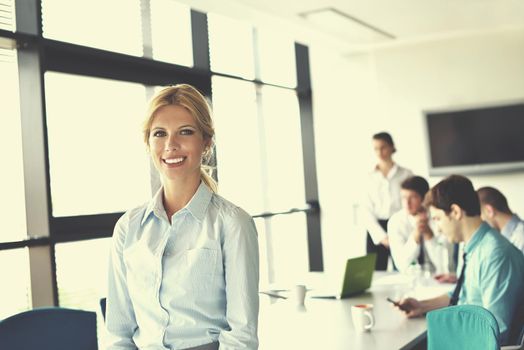 business woman  with her staff,  people group in background at modern bright office indoors